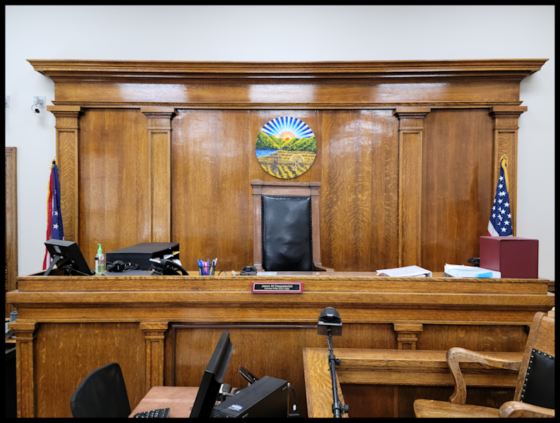 Photo showing the judge's bench and witness booth located in the common pleas court room. 